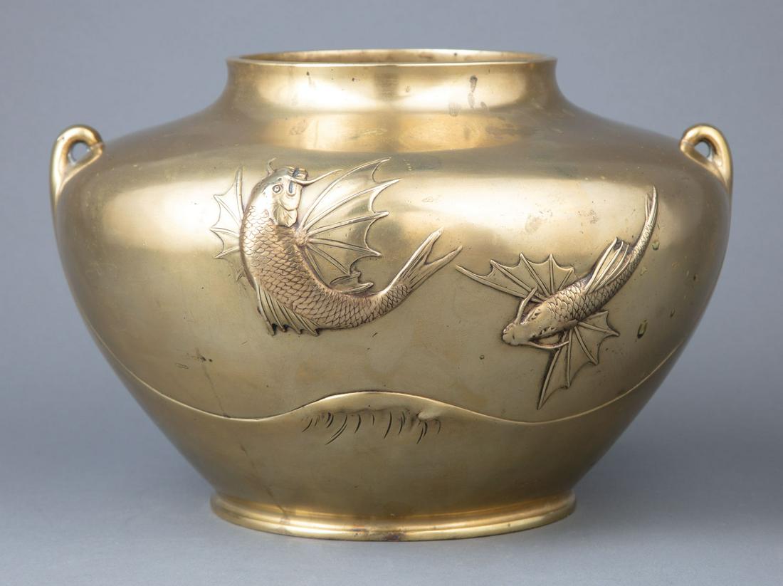 Japanese Polished Bronze Vase: Japanese Polished Bronze Vase , Meiji Period (1868-1912), relief-decorated with flying fish above waves, wave peak handles, h. 7 3/4 in., dia. 11 1/2 in Provenance: Skinner Auctioneers, Marlborough, M