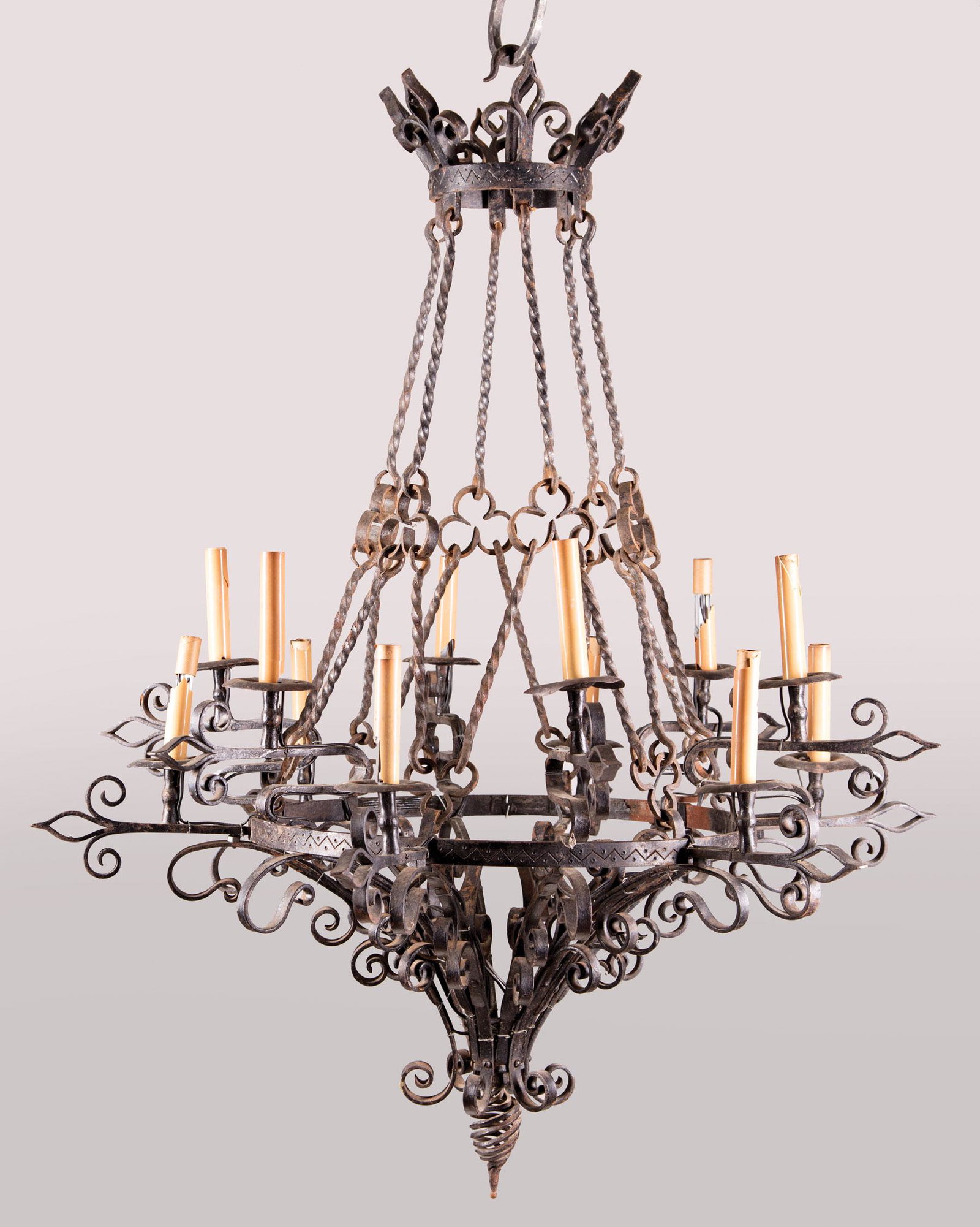 Renaissance Revival Iron Twelve-Light Chandelier: Renaissance Revival Iron Twelve-Light Chandelier , crown shaped corona, scroll arms, electrified, h. 41 in., dia. 33 in