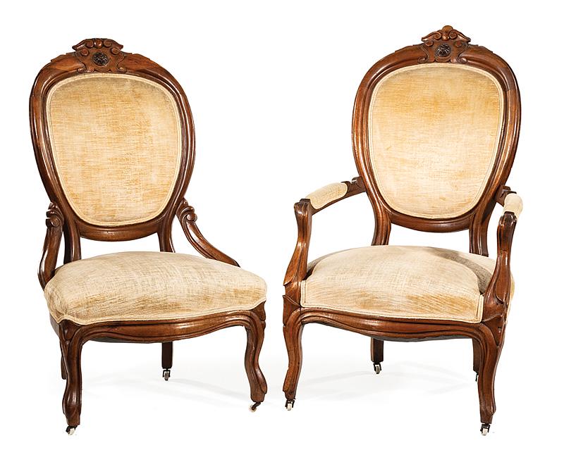 Pair of American Rococo Carved Walnut Armchairs: Pair of American Rococo Carved Walnut Armchairs , 19th c., crest mounted back, serpentine seats, cabriole legs, casters, h. 45 in., w. 25 1/4 in., d. 26 in. Condition: Structurally sound. Losses to ca