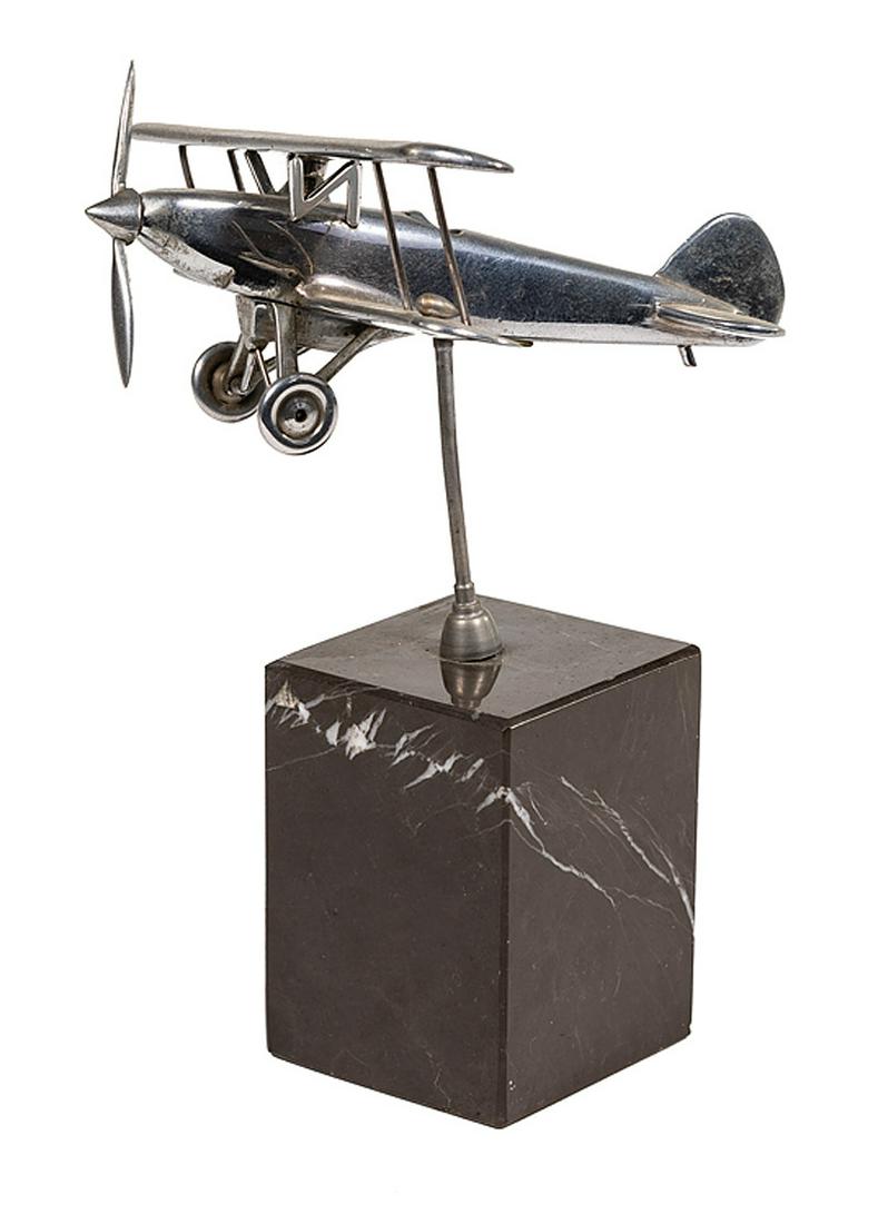 Art Deco Model of a Biplane: Art Deco Model of a Biplane , c.1930, nickel-plated model, mounted on a marble base, h. 7 1/2 in., wingspan 6 1/4 in