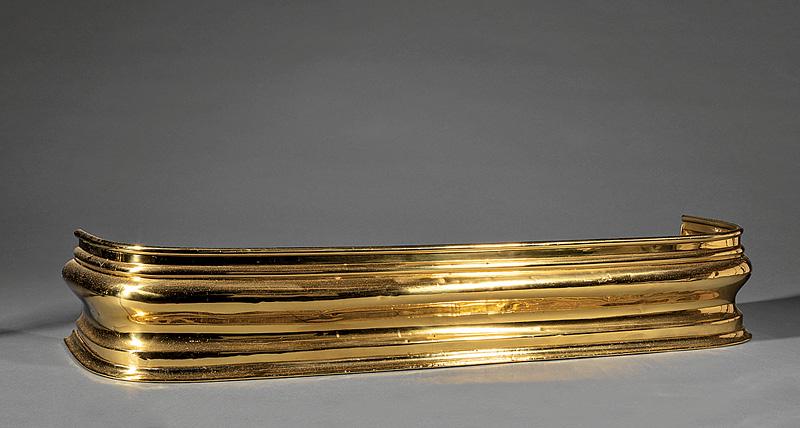 Classical-Style Molded Brass Fire Fender: Classical-Style Molded Brass Fire Fender , early-to-mid 20th c., h. 6 3/4 in., l. 39 1/4 in.; TOGETHER WITH pair of contemporary turned brass andirons, h. 19 3/4 in. (3 pcs.)