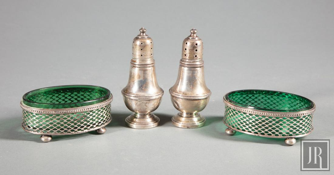 Sterling Silver and Green Glass Master Salts: Pair of Reticulated Sterling Silver and Green Glass Master Salts ; together with pair of sterling salt and pepper castors Provenance: Estate of Julia Evans Reed.