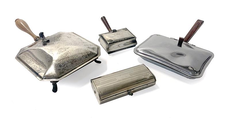 Group of Four Silent Butlers: Group of Four Silent Butlers , incl. 2 silverplate lidded vessels, one metal lidded vessel, and a table sweep (lacking handle), largest h. 3 in., w. 7 in., d. 12 1/2 in