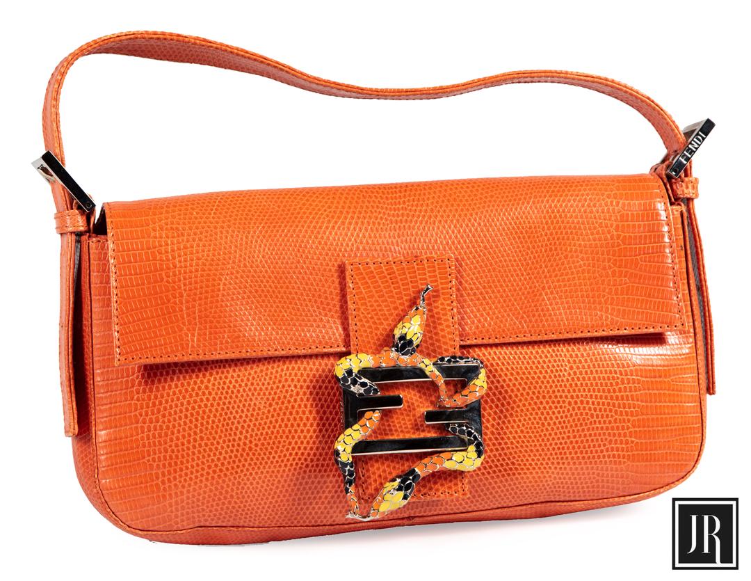 Fendi Orange Snakeskin Baguette Handbag: Fendi Orange Snakeskin Baguette Handbag , interior labeled "Fendi Made in Italy", snake embellished logo clasp, gold toned hardware, h. 6 in., l. 10 1/2 in., d. 2 1/2 in Provenance: Estate of Julia Ev