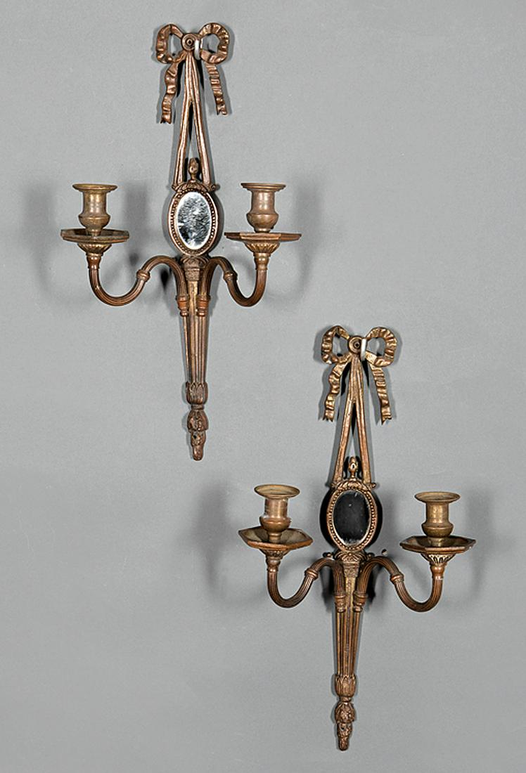 Louis XVI-Style Patinated Bronze Sconces: Pair of Louis XVI-Style Patinated Bronze Two-Light Sconces , 20th c., mirrored ribbon and torch backplate, h. 17 in., w. 9 1/2 in., d. 4 in