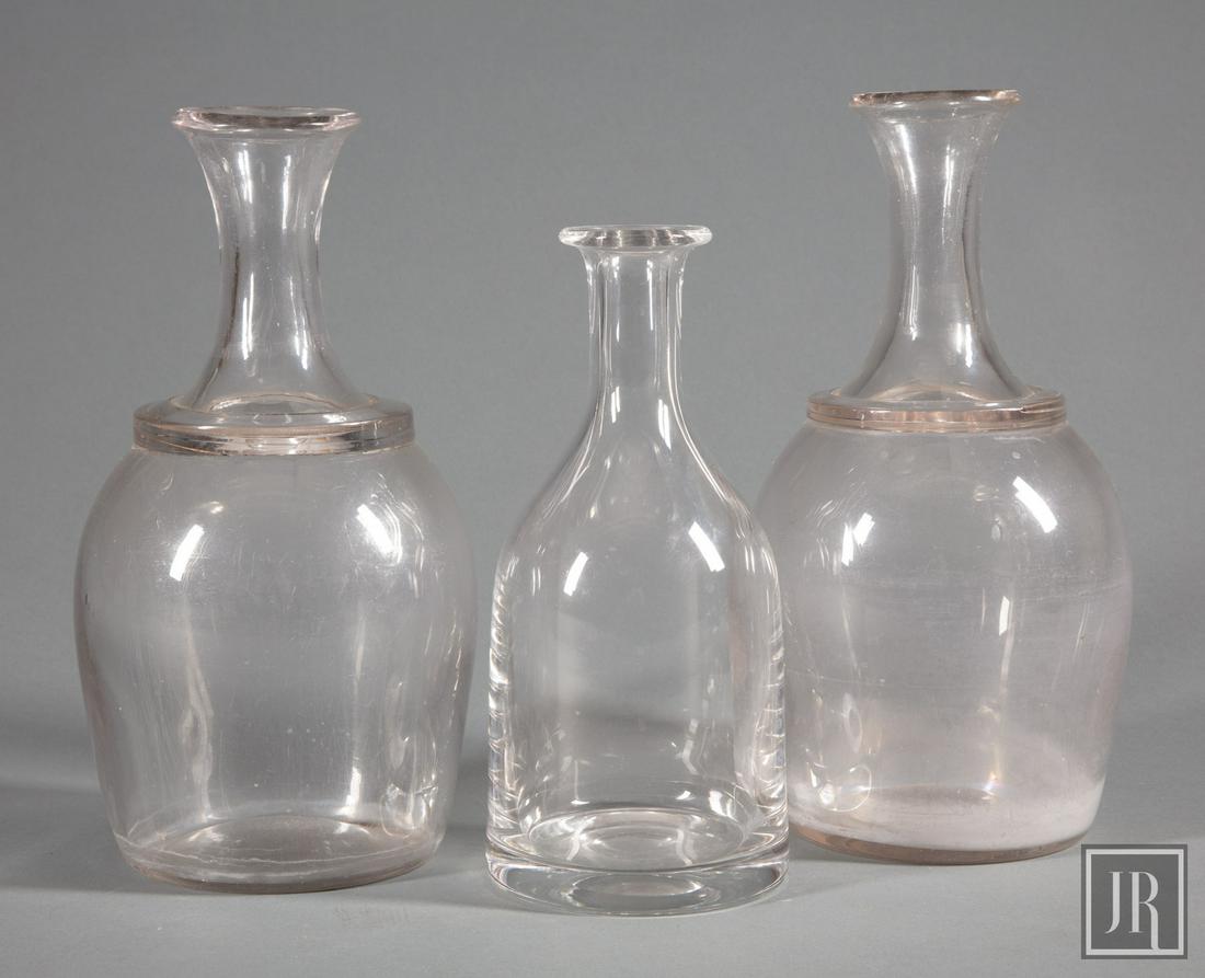 Two French Glass Cider Jugs: Two French Glass Cider Jugs , probably 19th c., probably Normandy, Provenace: Lucullus, h. 11 1/4 in.; together with a William Yeoward carafe, h. 9 1/2 in Provenance: Estate of Julia Evans Reed.