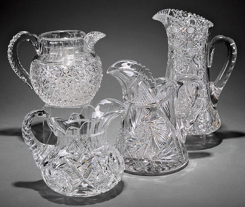 Four American Cut Crystal Pitchers: Four American Cut Crystal Pitchers , 2 "Russian" pattern, 2 "Pinwheel", h. 10 1/2 in., 8 1/2 in., 6 1/2 in., and 6 in . Provenance: Estate of Gordon and Vera Noakes, Detroit, MI