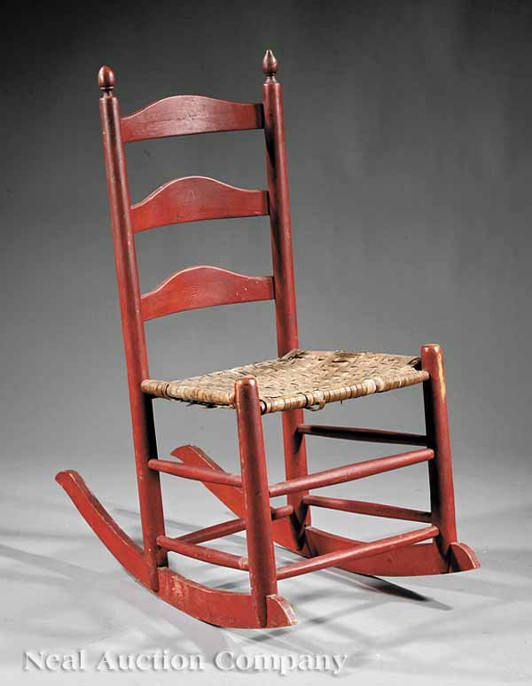 Late Federal Painted Ladder Back Rocking Chair: An American Late Federal Painted Ladder Back Rocking Chair , early 19th c., with turned finials, arched splats, splint seat, turned legs, stretchers, rockers . @B.76.14