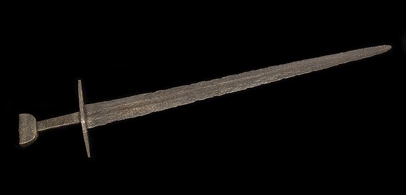Medieval Sword of Viking Type, Petersen Type X: Medieval Sword of Viking Type, Petersen Type X , 10th/11th c., in excavated condition, broad tapering double-edged blade with shallow fuller over most of length on each side to point, slightly arched 