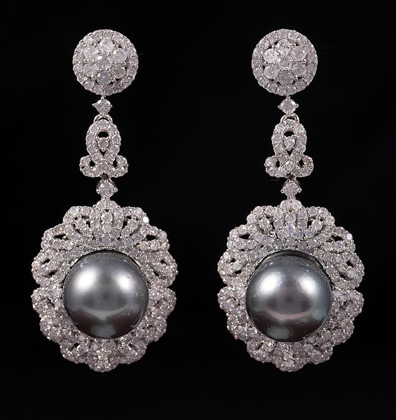 Gold, Tahitian Pearl and Diamond Dangle Earrings: Pair of 18 kt. White Gold, Tahitian Pearl and Diamond Dangle Earrings , drops with 2 round black pearls, 12 mm; floral bezel with 390 round brilliant cut diamonds, total wt. approx. 4.12 cts., G-I col