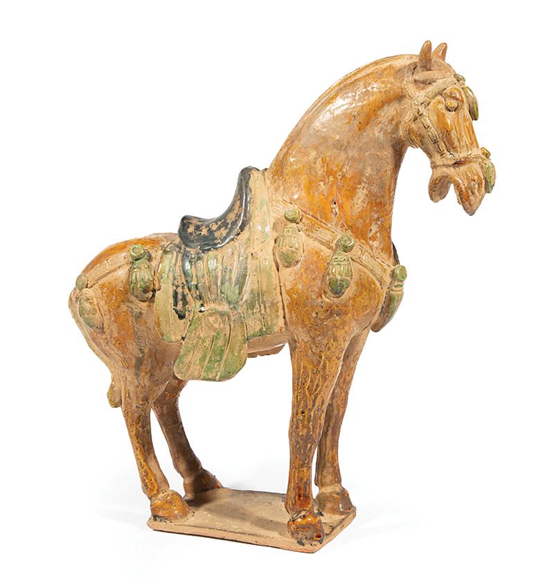 Chinese Tang-Style Sancai Glazed Pottery Horse: Chinese Tang-Style Sancai Glazed Pottery Horse , modeled standing on rectangular plinth, saddle, blanket, bridal and trimmings in green and blue glaze, body with ochre glaze, h. 15 1/4 in., w. 14 1/2 