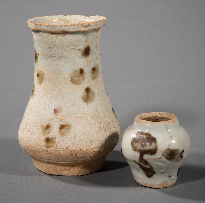 Two Chinese Russet Spotted Qingbai Pottery Vases: Two Chinese Russet Spotted Qingbai Pottery Vases , probably Yuan Dynasty (1279-1368), larger pear-form, h. 4 1/2 in.; smaller baluster, h. 2 in Provenance: Whisnant Galleries Collection, New Orleans, 