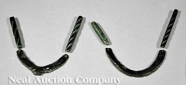 Mixtec Black Obsidian/Jet Jewelry Fragments: A Group of Six Mixtec Black Obsidian/Jet Jewelry Fragments ,c. 900-1519, four of hollow tubular form, two of pierced horseshoe form, heights 2 1/4 in. to 4 1/4 in