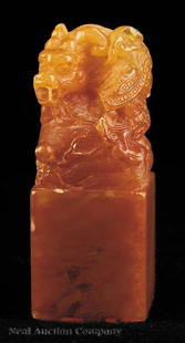 Chinese Carved and Incised Red Dragon Seal: A Chinese Carved and Incised Red Dragon Seal, Qing Dynasty, probably Qianlong Period (1736-1795), of rectangular section with the upper surface elaborately carved with a coiled dragon resting above a