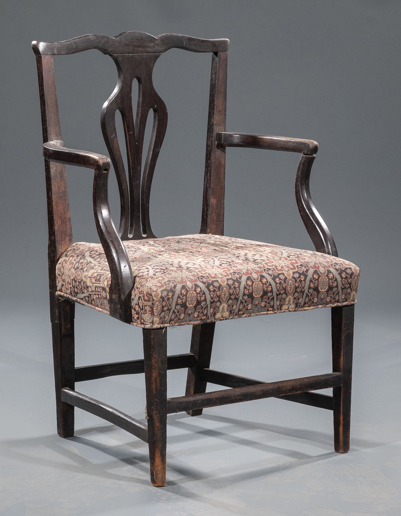 Chippendale-Style Carved Elm Armchair: Antique Chippendale-Style Carved Elm Armchair , 19th c., shaped crest, vasiform splat, shaped arms, square tapered legs, stretchers, h. 34 1/2 in., w. 23 in., d. 19 in. Condition: Structurally sound o