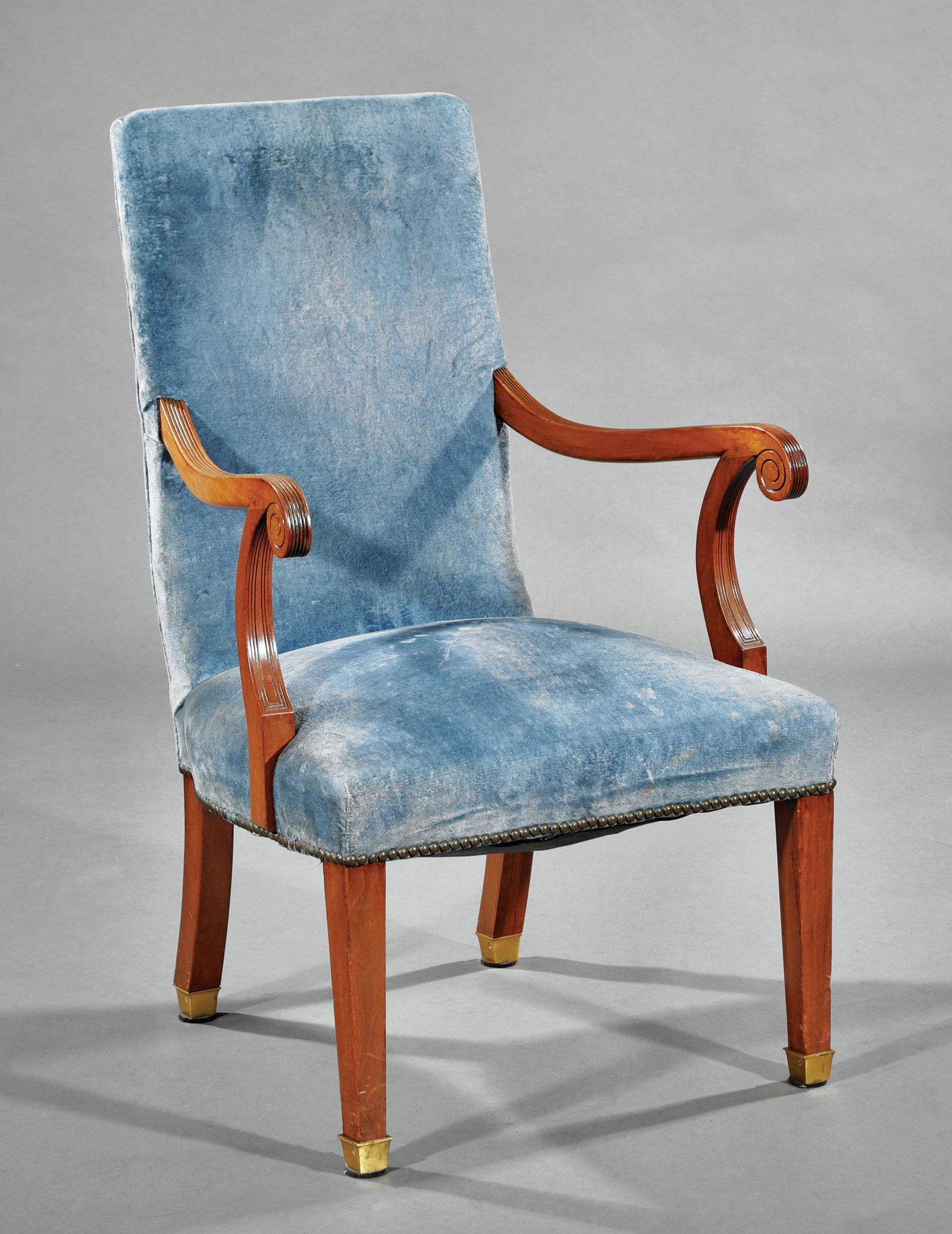 Georgian Carved Mahogany Armchair: Georgian Carved Mahogany Armchair , 19th c., padded back and seat, scrolled reeded arms, square tapered legs, brass cuffs , h. 37 1/4 in., w. 22 1/2 in., d. 21 1/2 in