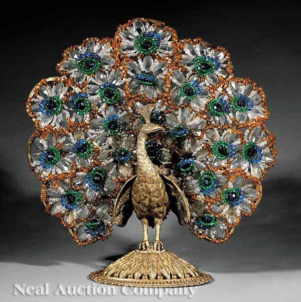 An Edwardian Beadwork Peacock Luminaire: An Edwardian Gilt Bronze and Beadwork Peacock Luminaire, c. 1900, peacock with framework fitted with beads and cut-glass, back lit with three lights, on oval base modeled with feathers and egg and dar