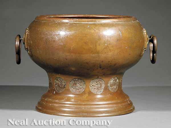 A Japanese Bronze Hibachi Pot: A Japanese Bronze Hibachi Pot, 19th c., bulbous flared body, turned base, height 9 1/2 in., diameter 10 in