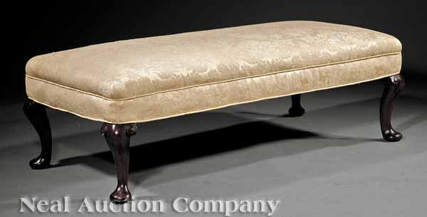 An Antique Queen Anne-Style Carved Mahogany Bench: An Antique Queen Anne-Style Carved Mahogany Bench, mid-19th c., the rectangular upholstered seat in yellow damask, cabriole legs, pad feet, height 14 1/2 in., width 48 in., depth 23 in