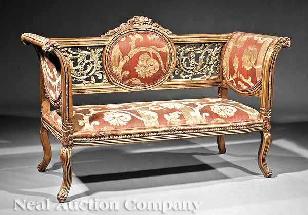 A Rococo-Style Settee, in the Italian Taste: A Rococo-Style Carved, Gilded and Paint-Decorated Settee in the Italian Taste, pierced foliate-carved back centering an oval, reeded scrolled leaf-carved arms, shaped reeded seat rail on cabriole legs