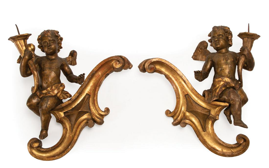 Carved Giltwood Figural Wall Prickets: Pair of Italian Carved Giltwood Figural Wall Prickets , 19th c., cherub and scroll design, h. 18 in., w. 17 in., d. 5 in