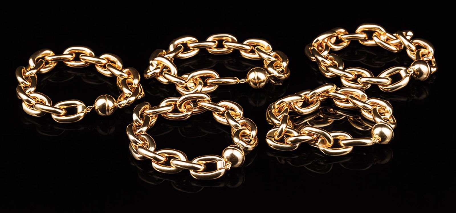 Five Italian Gold Chain Link Bracelets: Five Italian 14 kt. Yellow Gold Chain Link Bracelets , with magnetic ball clasps, each l. 8 in., total wt. 42.50 dwt. **Please note: Payment for all jewelry purchases must be made by cash, check or wi