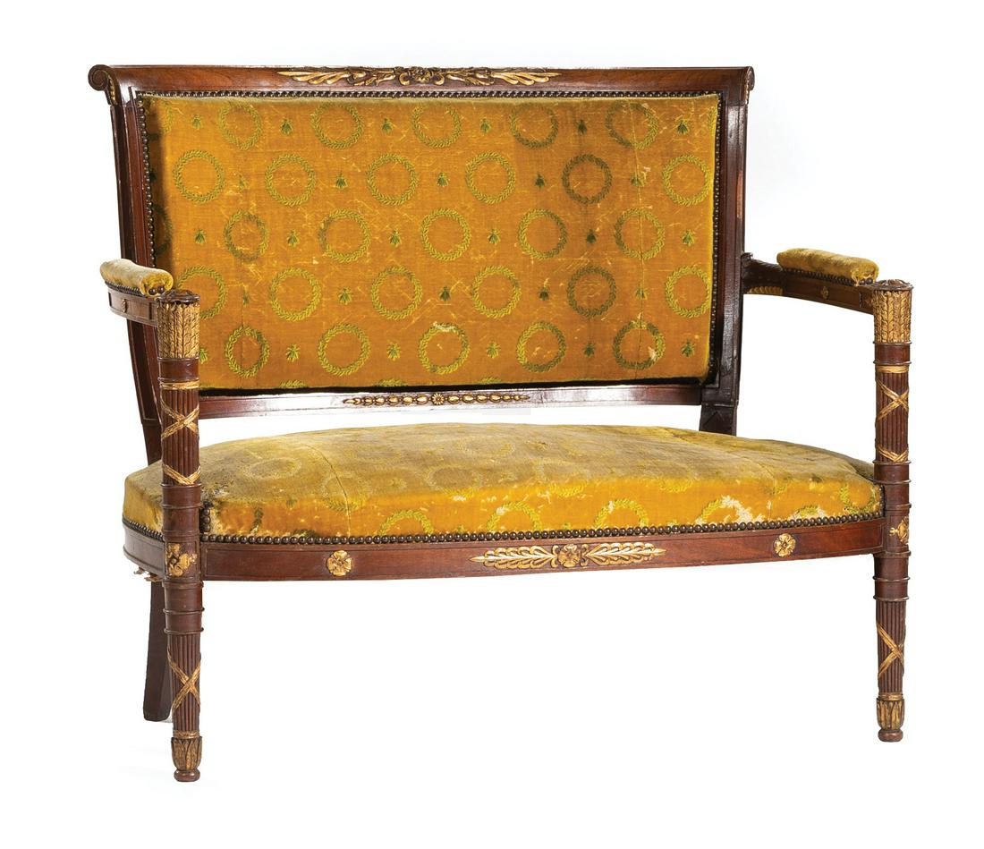 French Carved Mahogany and Gilt Salon Suite: Nine-Piece French Empire Carved Mahogany and Gilt Salon Suite , early-to-mid 19th c., incl. canape, 4 fauteuils, 4 chaises, scroll back, padded arms, rosette capped bound "arrow" quiver stiles, foliat