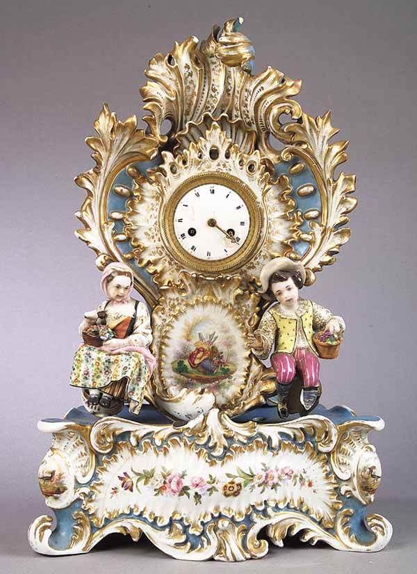 Vieux Paris Porcelain Figural Mantel: A Vieux Paris Porcelain Figural Mantel Clock, mid-19th c., signed Jacob Petit and bearing JP mark in underglaze blue on base, shell and scroll form body and base, the reserves painted with birds, garl