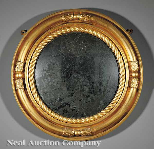 English Carved and Gilded Convex Mirror: An English Carved and Gilded Convex Mirror, 19th c., circular frame with spherules, acanthus and rope-twist decoration, retains original mirror plate, diameter 26 in