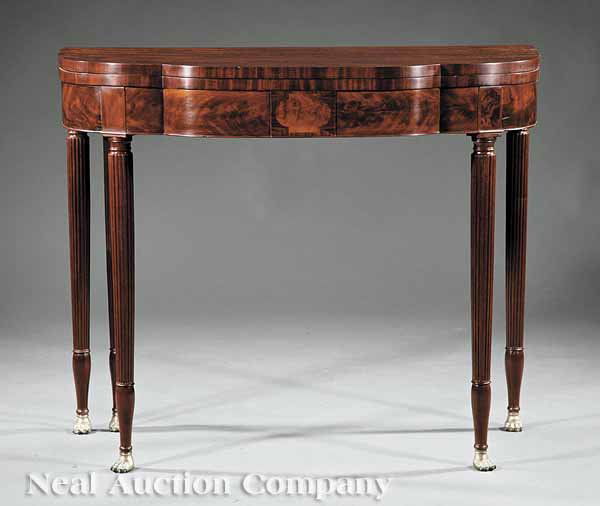 Mahogany Card Table attrib. Phyfe: An American Classical Mahogany Card Table, early 19th c., attributed to Duncan Phyfe, New York, lobed foldover top, figured frieze with a central tablet, on tapered and reeded legs ending in brass paw