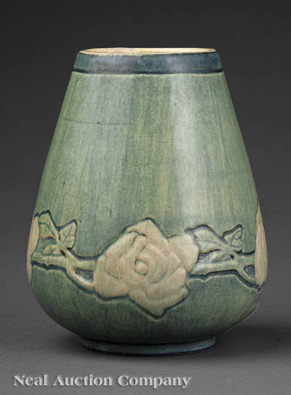Newcomb College Art Pottery Vase: A Newcomb College Art Pottery Vase, 1912, relief-carved with a band of Cherokee roses and decorated in matte glaze with blue, green and white underglaze by Alma Florence Mason, base marked with Newcom