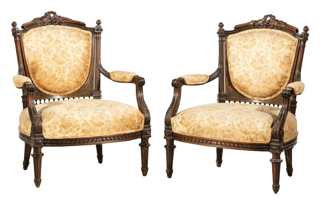 Louis XVI Carved Mahogany Armchairs: Pair of Antique Louis XVI Carved Mahogany Armchairs , beribboned fluted stiles, padded arms, fluted tapered legs , h. 35 in., w. 26 1/2 in., d. 19 in Provenance: Whisnant Galleries Collection, New Orl