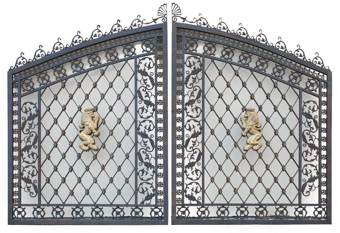 Napoleon III-Style Cast Iron Gates: Pair of Large Napoleon III-Style Cast Iron Gates , arched form with central latticework panels centered by gilt lions rampant, flanked by acanthus scroll and floral pinwheel borders , h. 108 in., w. 1