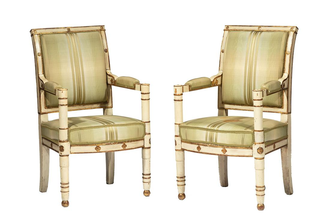 French Consulat Fauteuils: Pair of French Consulat Crème Peinte and Parcel-Gilt Fauteuils , late 18th/early 19th c., molded padded back, padded arms, tubular ring turned stiles, arched seat rail, spherule feet , h. 36 1/2 in.,