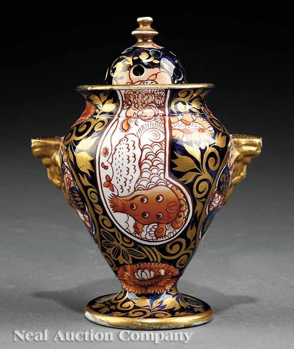 Mason's Ironstone Lidded Potpourrr Vase: A Mason's Ironstone "Imari" Motif Lidded Potpourri Vase, c. 1820, richly painted and gilt, gilt mask handles, circular impressed mark, height 6 1/8 in., width 4 1/2 in