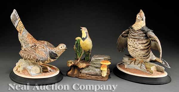 Three Boehm Porcelain Figurines: Three Boehm Porcelain Figurines, comprising a pair of ruffed grouse cock and hen figurines, each signed, each height 11 3/8 in., and a meadowlark, stamped, numbered 435I, height 8 3/8