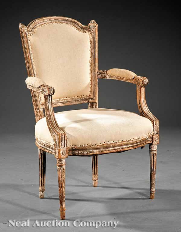 Louis XVI Paint-Decorated Fauteuil: A Louis XVI Paint-Decorated Fauteuil, 18th c., molded arched back with finials, padded scroll arms, rounded seat rail, fluted tapered legs topped with rosettes