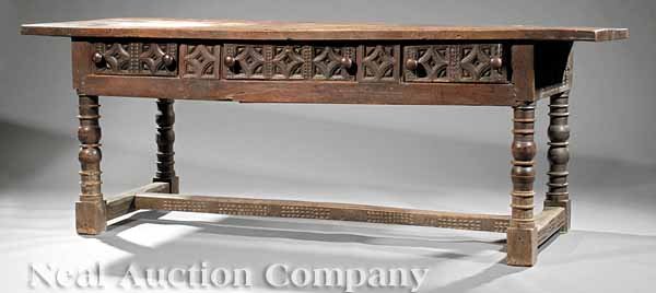 Spanish Baroque Walnut Refectory Table: A Large Spanish Baroque Walnut Refectory Table, 18th c., single board top, frieze and drawers with carved panels, blocked and turned legs, "I" stretchers, pegged construction throughout, height 32 1/2