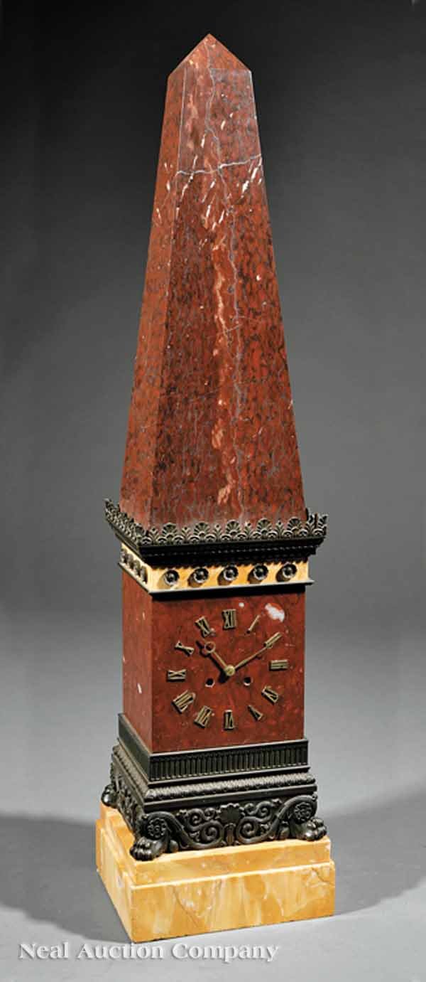 Bronze-Mounted Griotte, Sienna Marble Clock: A Charles X Bronze-Mounted Griotte and Sienna Marble Clock, c. 1825-1830, the obelisk supported on a galleried and rosette-mounted pediment, lower frieze of scrolls on paw feet, the silk thread moveme
