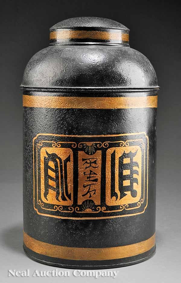 Tole Peinte Tea Canister: A Tole Peinte Tea Canister, black ground with gold banding and Oriental cartouche with Chinese characters, height 16 1/4 in., diameter 9 1/2 in