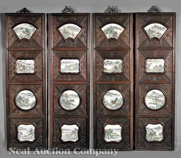 Four Chinese Carved Wood Panels with Plaques: A Set of Four Chinese Carved Wood Panels with Famille Rose Porcelain Plaques, late 19th/early 20th c., each hardwood panel relief carved with bamboo, prunus and other flowering branches and vines, and