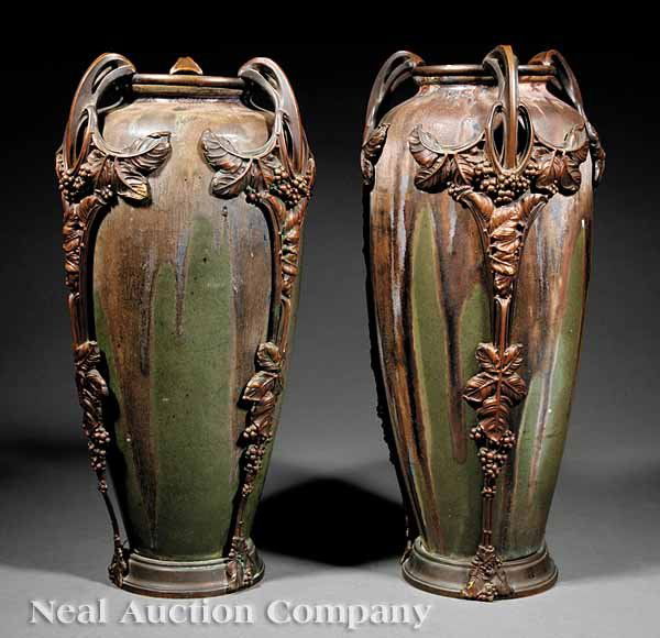 Pair of Art Nouveau Bronze-Mounted Vases: A Pair of Art Nouveau Bronze-Mounted Vases, c. 1905, by Charles Greber (French, 1853-1935), incised signatures, each elongated tapered form decorated with flowers in earth tones over an olive ground,