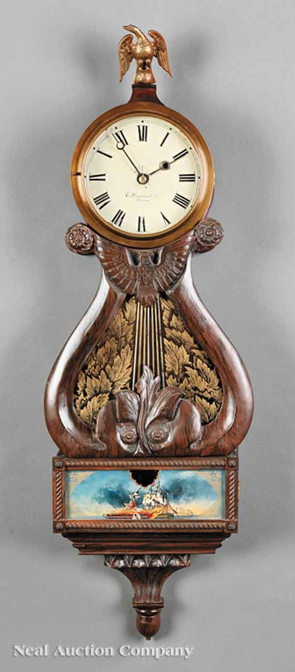 An E. Howard Grain-Painted Lyre Banjo Clock: An E. Howard Grain-Painted Lyre Banjo Clock, c. 1900, original paper label, movement signed "E. Howard & Co., Boston", and "59", lyre-form case with spread eagle, center glass with gilt acanthus, the 