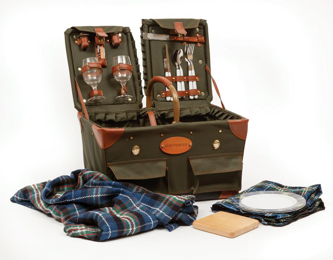 Well-Fitted Canvas Picnic Basket: Well-Fitted Canvas Picnic Basket , labeled "Gun-Fighter/Picnic Time", leatherette trim, interior outfitted for two persons, incl. wine glasses, knives, forks and spoons, bread knife, cutting board, sa