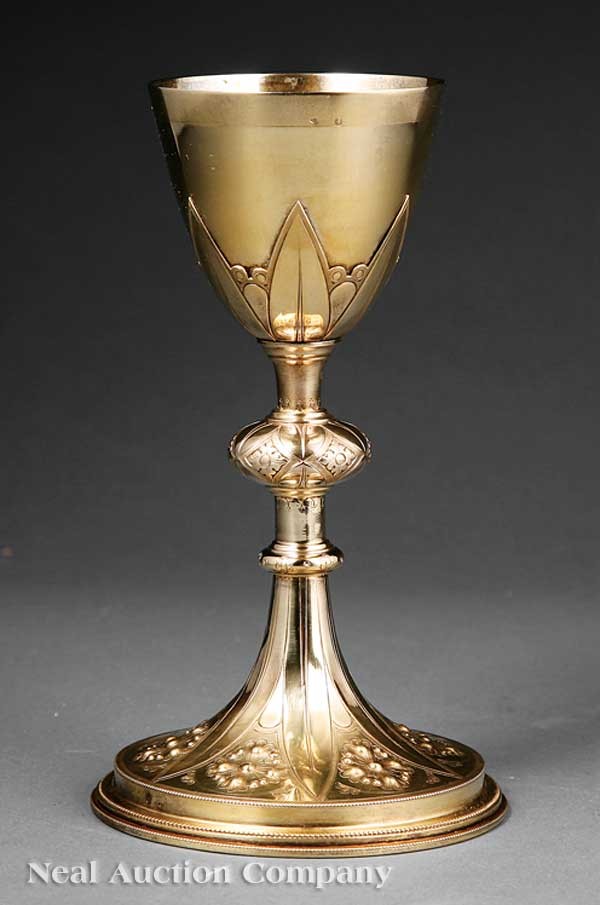French Silver Gilt Chalice: An Antique French Silver Gilt Chalice, marks rubbed, the bowl with stiff leaf decoration, knopped stem, spreading foot with stiff leaf and rosette decoration, height 9 1/4 in., weight 11.00 troy ozs