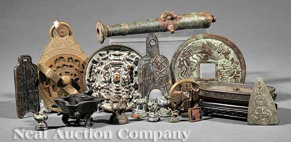 Group of Chinese Bronze Objects: A Group of Antique Chinese Bronze Objects, including: a diminutive bronze model of a cannon, length 8 in.; a small bronze vessel in the form of a bird perched on a lotus blossom, height 2 in.; two bro