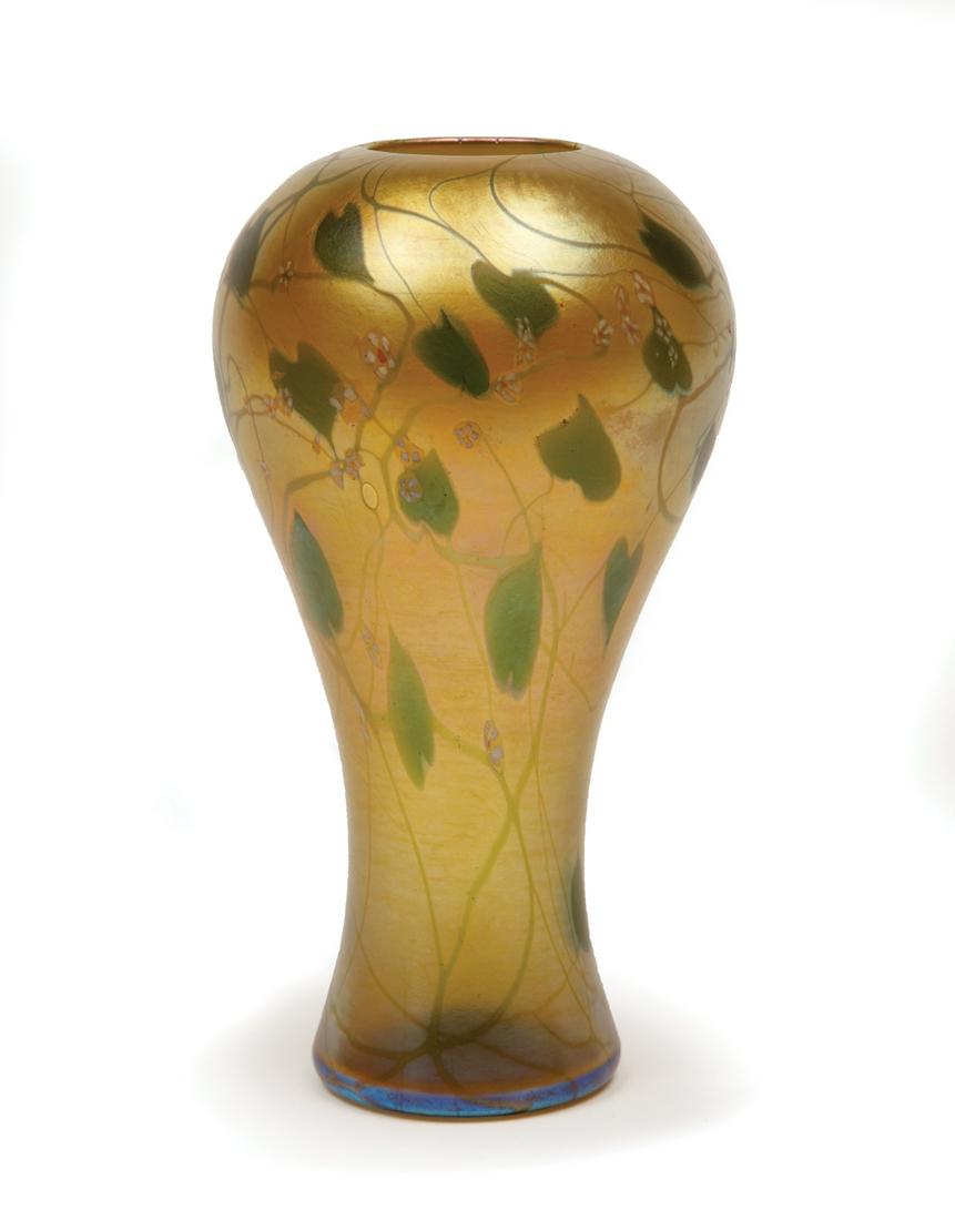 Tiffany Favrile Glass Vase: Tiffany Favrile Glass Vase , early 20th c., etched marks "L.C. Tiffany", "Favrile" and "4128H", intaglio cut with colorful flowering, leafy vines, h. 7 3/8 in