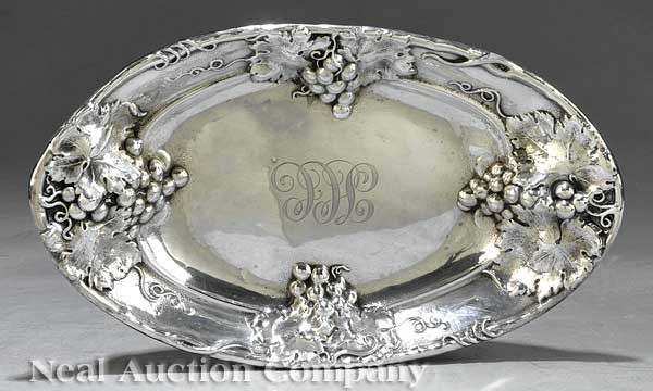 Mauser Mfg. Co. Sterling Silver Repousse Bread Tr: An American Art Nouveau Sterling Silver Repousse Bread Tray, Mauser Mfg. Co., New York, 1887-1903, grape and grapeleaf motif, script monogram, height 1 7/8 in., length 12 7/8 in., width 7 5/8 in., wei