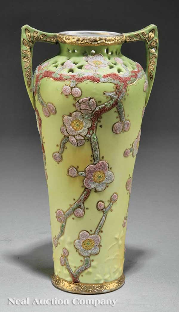 Japanese "Nippon" Moriage Twin Handled Porcelain : A Japanese "Nippon" Moriage Twin Handled Porcelain Vase, early 20th c., overall coralene decoration of prunus blossoms, raised gilt highlights, pierced neck, height 9 3/4 in., width 4 7/8 in