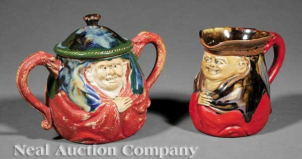 Two Japanese Sumida Ware "Toby" Table Articles: Two Japanese Sumida Ware "Toby" Table Articles, early 20th c., comprising a lidded sugar and creamer, each with red ground and flambe glaze shoulder, porcelain cartouche signed "Ryosai", dragon handle